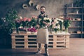 Full length body size view photo of charming lovely nice millennial people small business representative hold hand roses Royalty Free Stock Photo