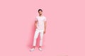 Full length body size view portrait of his he nice attractive lovely well-dressed content guy posing isolated over pink