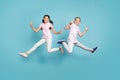 Full length body size view of two attractive small little cheerful best buddy fellow friends friendship jumping showing
