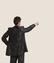 Full length of business man pointing at copyspace Royalty Free Stock Photo