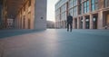 Full length of businessman walking along street downtown Royalty Free Stock Photo