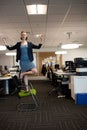 Full length of businesswoman practicing yoga