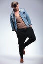 Full length of casual man on one leg Royalty Free Stock Photo