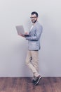 Full length of cheerful brunet bearded business man in formal w Royalty Free Stock Photo