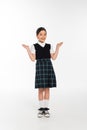 full length, cheerful schoolkid in uniform