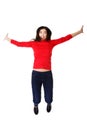 Full length cheerful woman jumping Royalty Free Stock Photo
