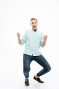 Full length of cheerful young man celebrating success Royalty Free Stock Photo