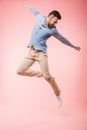 Full length of a cheerful young man jumping Royalty Free Stock Photo