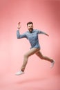 Full length of a cheerful young man running Royalty Free Stock Photo