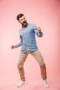 Full length of a cheerful young man standing Royalty Free Stock Photo