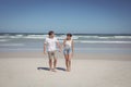 Full length of couple holding hands at beach Royalty Free Stock Photo