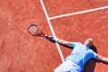 Full length of disappointed mature man lying by tennis racket on court during summer Royalty Free Stock Photo