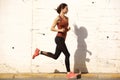 Full length fitness woman on morning run outdoors Royalty Free Stock Photo