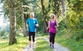 Two active seniors with a healthy lifestyle smiling while joggin Royalty Free Stock Photo