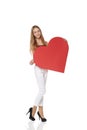 Full length girl holding up a red cardboard heart, ioslated on w Royalty Free Stock Photo