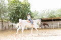 Girl Enjoying Her Ride On Trained Horse