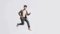 Full length handsome Asian man happy smile and looking at camera he is run in air on isolated white background Royalty Free Stock Photo