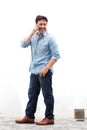 Full length happy mature guy talking on cell phone Royalty Free Stock Photo