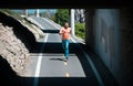 Full length of healthy man running and sprinting outdoors. Young fitness sport male runner running on city road. Royalty Free Stock Photo