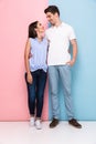 Full length image of attractive man and woman in casual wear hug Royalty Free Stock Photo