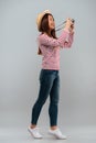 Full length image of cheerful asian woman in sweater Royalty Free Stock Photo