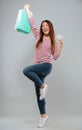 Full length image of Happy asian woman in sweater rejoice Royalty Free Stock Photo