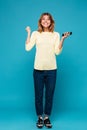 Full length image of Happy woman in sweater rejoice Royalty Free Stock Photo