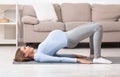 Full length image of pregnant girl doing stretching exercise Royalty Free Stock Photo