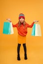 Full length image of Shocked girl in sweater and hat