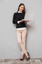 Full length image of Smiling asian woman in business clothes Royalty Free Stock Photo