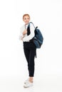 Full length image of smiling gigner student woman with backpack Royalty Free Stock Photo