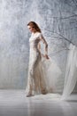 full length of joyful middle aged bride in white wedding dress