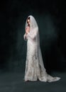 full length of joyful middle aged bride in white wedding dress