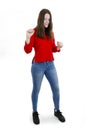 Full length of joyful teenage girl, dancing. Studio shot. Attractive beautiful adorable young girl. Full length. Royalty Free Stock Photo