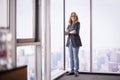 Mid aged businesswoman wearing business casual and standing in the office Royalty Free Stock Photo