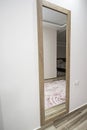 Full length mirror on wall of bedroom in luxury home