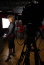 Full length newscaster in tv studio