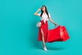 Full length photo of adorable cute lady dressed white crop top purse eyewear red shoppers empty space isolated turquoise