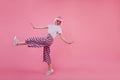 Full-length photo of amazing stylish girl in pink pants dancing in studio. Portrait of glad young w