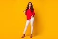 Full length photo of attractive bossy business lady look side empty space playing long curl wear red office shirt white