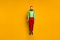 Full length photo of attractive funky guy open mouth jumping high rejoicing shocked wear green shirt red suspenders Royalty Free Stock Photo