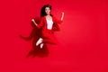 Full length photo of attractive lady worker having fun jumping high up good mood celebrate startup success wear blazer Royalty Free Stock Photo