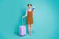 Full length photo of attractive pretty cute excited glad top knot hairstyle lady got visa ready trip abroad hold luggage Royalty Free Stock Photo