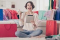 Full length photo of brunette bob haired young woman point finger idea hold tablet excited addicted shopping indoors