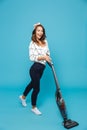 Full length photo of brunette optimistic woman 20s housekeeping