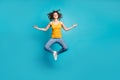 Full length photo of calm tranquil lady jump high practicing morning yoga isolated blue color background