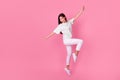 Full length photo of carefree excited vietnamese person jumping good mood isolated on pink color background