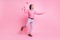 Full length photo of charming brunet hair cupid guy shooting heart arrows empty space isolated pink color background