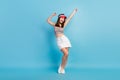 Full length photo of charming pretty young woman dance good mood wear tennis hat isolated on blue color background