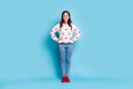 Full length photo of charming sweet young woman dressed hearts print pullover hands arms waist isolated blue color